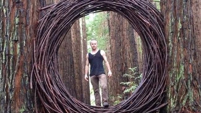 Warburton artist David Digapony with his Wild and Woven work in the redwood forest. Picture: supplied