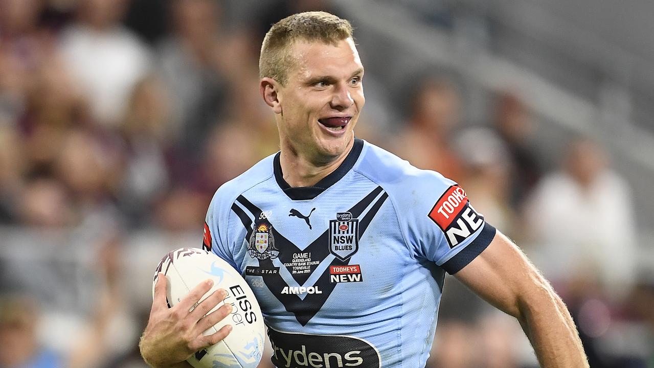 TOWNSVILLE, AUSTRALIA - JUNE 09: Tom Trbojevic of the Blues runs to score a try during game one of the 2021 State of Origin series between the New South Wales Blues and the Queensland Maroons at Queensland Country Bank Stadium on June 09, 2021 in Townsville, Australia. (Photo by Ian Hitchcock/Getty Images)