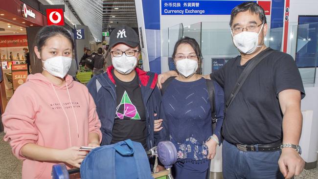 Sigi Xu, Sunny Wu, Wei Wu and Minruo Wei wore masks on their flight from China to Melbourne. Picture: Rob Leeson