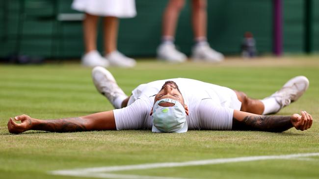 Nick Kyrgios reacts after beating Cristian Garin to make it through to the Wimbledon semi finals. Picture: Getty Images