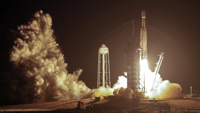 The Falcon Heavy blasts off from Cape Canaveral yesterday. Picture: AP.