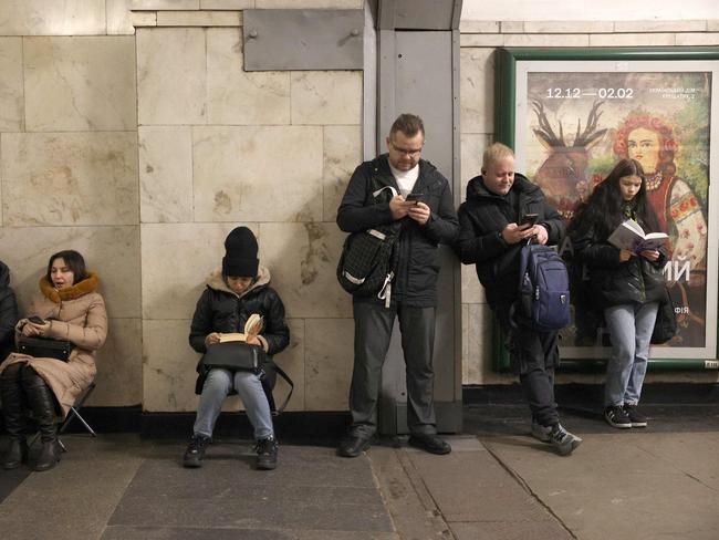 Local residents take shelter in a metro station during an air strike alarm in Kyiv on December 25, 2024, amid the Russian invasion of Ukraine. Picture: AFP