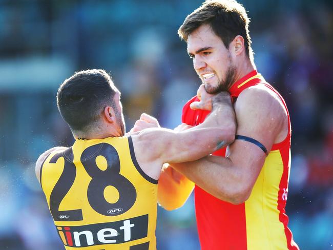 Jack Leslie of the Suns (L) and Paul Puopolo of the Hawks wrestle off the ball during the round 14 AFL match between the Hawthorn Hawks and the Gold Coast Suns at University of Tasmania Stadium on June 23, 2018 in Launceston, Australia. Picture: Michael Dodge, Getty Images.