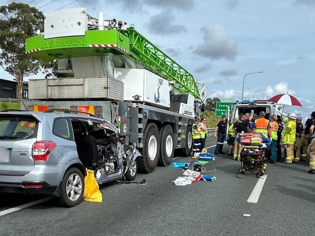 A teenager is fighting for life after his car ran into the back of a crane on the Bruce Highway near Cooroy.