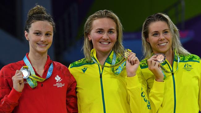 Canada's Summer McIntosh (L) with her silver medal alongside gold medallist Ariarne Titmus (C) and bronze medallist Kiah Melverton at the medal presentation for the women's 400m freestyle swimming final on day six of the Commonwealth Games in 2022.