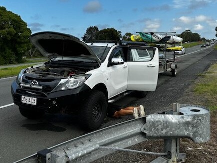 Ben Carberry trying to fix his ute.