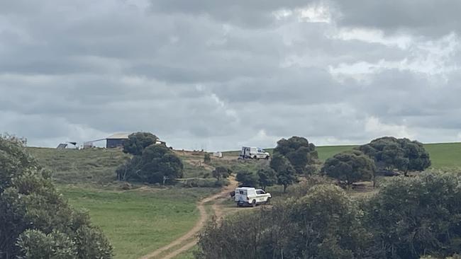 Police vehicles at the Port Neill property where a man was arrested for murder. Picture: Todd Lewis