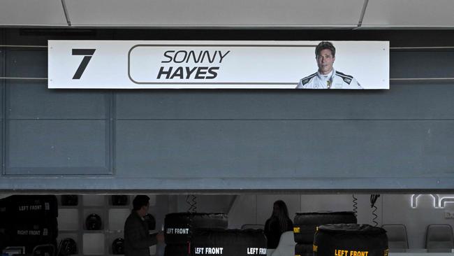 A plate bearing an image of US actor Brad Pitt, playing Sonny Hayes, the driver of the fictional Apex team, hangs above his fictional garage, at the Silverstone motor racing circuit. Picture: AFP