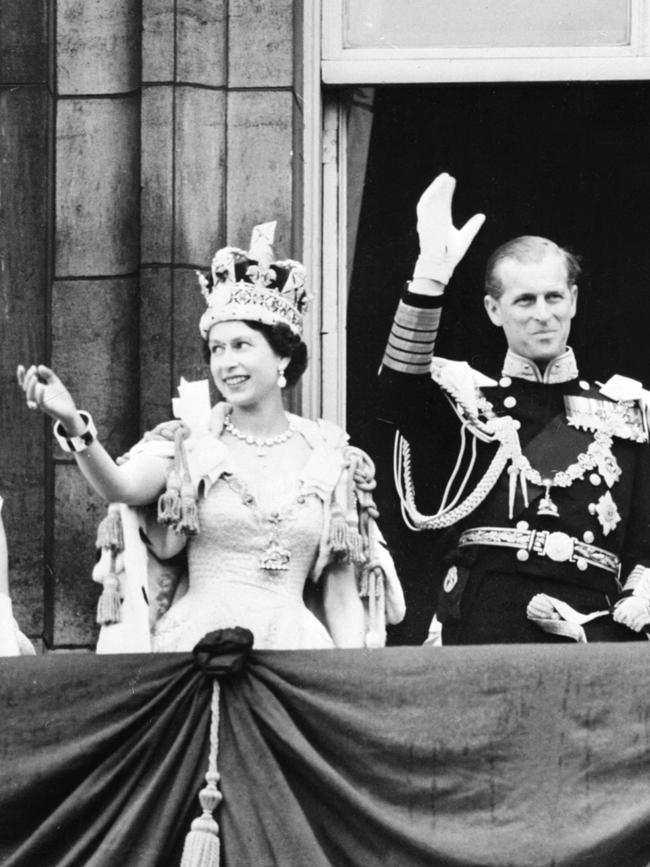 Queen Elizabeth II and Prince Philip, Duke of Edinburgh wave to the crowd, after the coronation at Westminster Abbey in London. Picture: AFP.