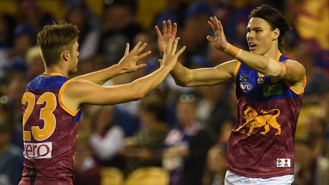 Josh Schache (left) and Eric Hipwood of the Lions react after Hipwood kicked a goal during the round 5 AFL match between the Western Bulldogs and the Brisbane Lions at Etihad Stadium in Melbourne, Saturday, April 22, 2017. (AAP Image/Julian Smith) NO ARCHIVING, EDITORIAL USE ONLY