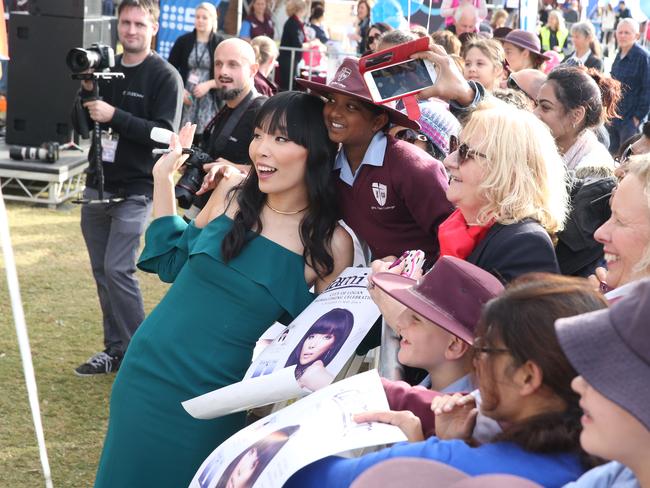 The Sound Of Silence star was swamped by fans when she returned to her old high school John Paul College in Daisy Hill, Brisbane. Picture: Liam Kidston