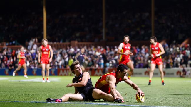 Caleb Serong and Brayden Fiorini compete for the ball in front of the Norwood Oval grandstand. Photo by Michael Willson/AFL Photos via Getty Images.