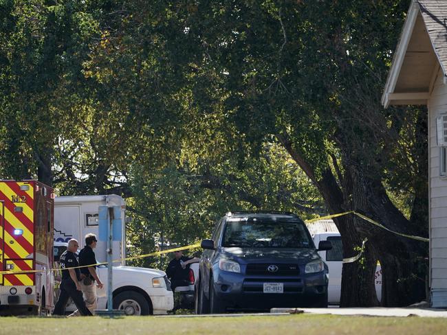 First responders work at the rear of the First Baptist Church. Picture: AP