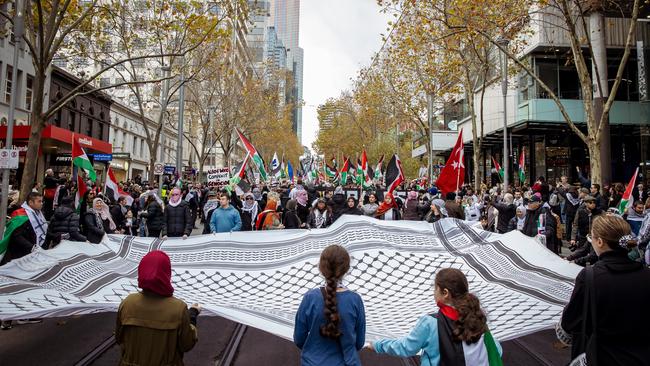 A keffiyeh is held out at the pro-Palestine rally in Melbourne in early June. Picture: NewsWire/Tamati Smith