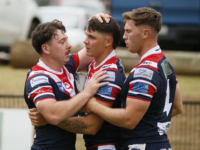 The Camden players celebrate another try.