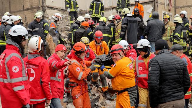 Rescuers carry a body at the site of a heavily damaged multi-story apartment building, following a Russian drone attack, in Odessa. Picture: AFP