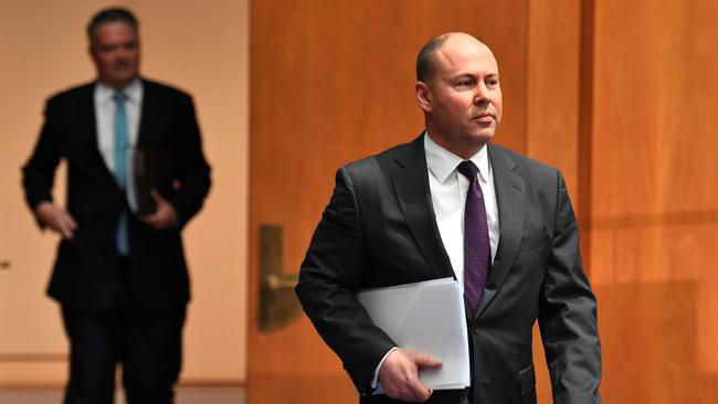 Josh Frydenberg is shadowed by Mathias Cormann on his way to a press conference at Parliament House on Thursday. Picture: Getty Images