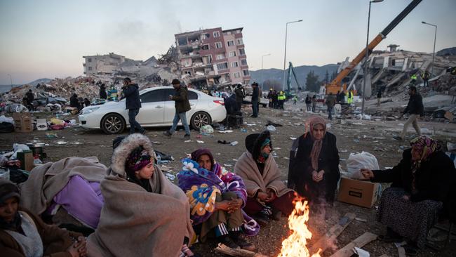 People wait for news of their loved ones, believed to be trapped under collapsed buildings. Picture: Getty Images.