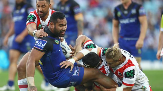 SYDNEY, AUSTRALIA - JUNE 13: Tony Williams of the Bulldogs is tackled during the round 14 NRL match between the St George Illawarra Dragons and the Canterbury Bulldogs at ANZ Stadium on June 13, 2016 in Sydney, Australia. (Photo by Mark Kolbe/Getty Images)