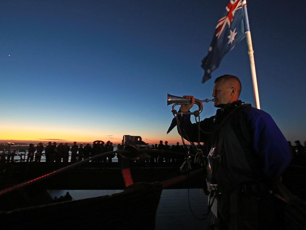 A dawn service was held on the summit of the Sydney Harbour Bridge to commemorate ANZAC Day. Bugler and Leading seaman Marcus Salone plays The Last Post on top of the bridge. Picture: Toby Zerna