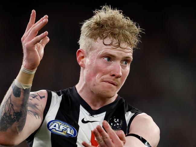 MELBOURNE, AUSTRALIA - AUGUST 17: John Noble of the Magpies kicks the ball during the 2024 AFL Round 23 match between the Collingwood Magpies and the Brisbane Lions at The Melbourne Cricket Ground on August 17, 2024 in Melbourne, Australia. (Photo by Michael Willson/AFL Photos via Getty Images)