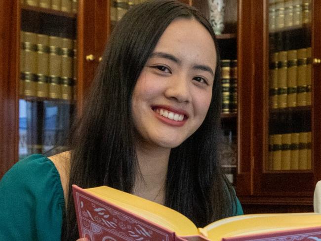 February 6, 2025:  18-year-old student Mia Ohara Ngo, the 2025 Tennyson Medal recipient, with a selection of fav books, with Her Excellency the Honourable Frances Adamson AC, Governor of South Australia, in the Government House library. Picture: Kelly Barnes