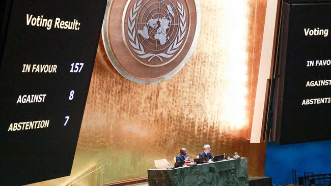 A screen shows the results of the vote on the resolution entitled "Peaceful settlement of the question of Palestine" at the General Assembly 46th plenary meeting on December 3, 2024, at the UN headquarters in New York City. (Photo by Kena Betancur / AFP)