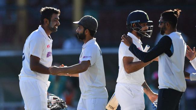 India celebrates one of the great saves in Test cricket at the SCG. Picture: Saeed Khan/AFP