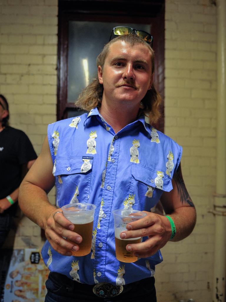 Participants are seen during Mulletfest, a special event designed to celebrate the hairstyle that's all about business at the front, party at the back, at Chelmsford Hotel in Kurri Kurri, NSW. (AAP Image/Perry Duffin) 