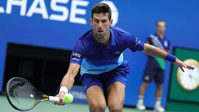 Novak Djokovic of Serbia returns the ball against Daniil Medvedev of Russia.