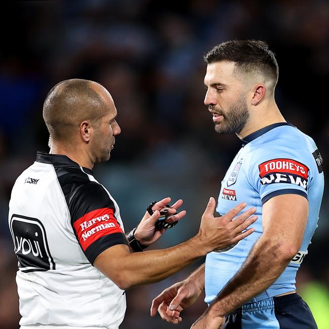 Blues captain James Tedesco talks to referee Ashley Klein after the disallowed try. Picture: Mark Kolbe/Getty Images