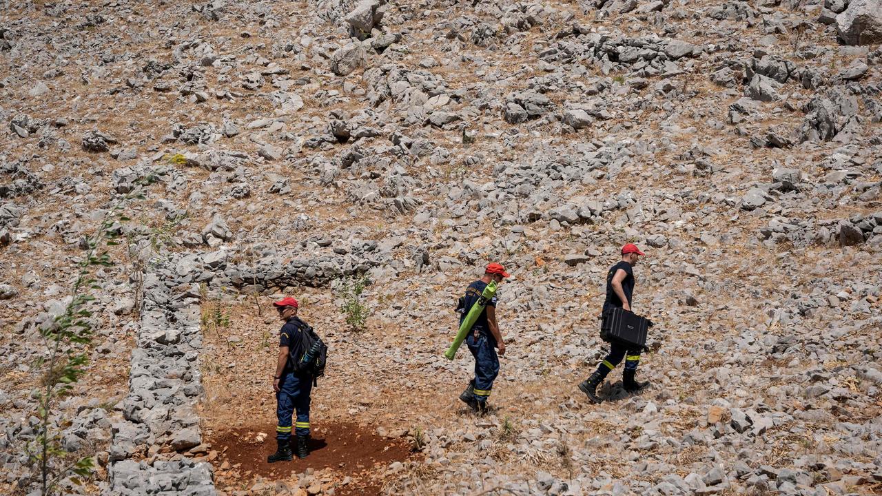 Firefighters during the search and rescue operation. Picture: AFP