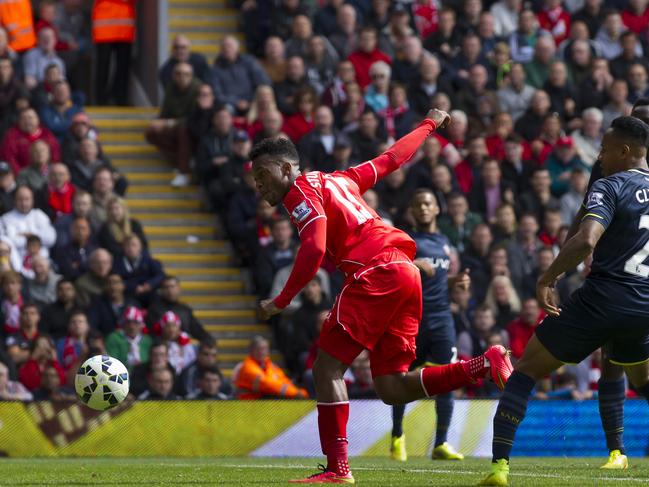 Liverpool's Daniel Sturridge, center, scores against Southampton during their English Premier League soccer match at Anfield Stadium, Liverpool, England, Sunday Aug. 17, 2014. (AP Photo/Jon Super)