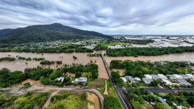 The Barron River in Cairns, Far North Queensland, has reached a record flood peak, with roads closed and homes flooded in the catchment area. Flood waters lap at the Kamerunga bridge on the Western Road, and despite the bridge remaining open, road access is still cut to the northern beaches of Cairns. The record flooding has been caused by ex Tropical Cyclone Jasper, which made landfall on December 13. Picture: Brendan Radke