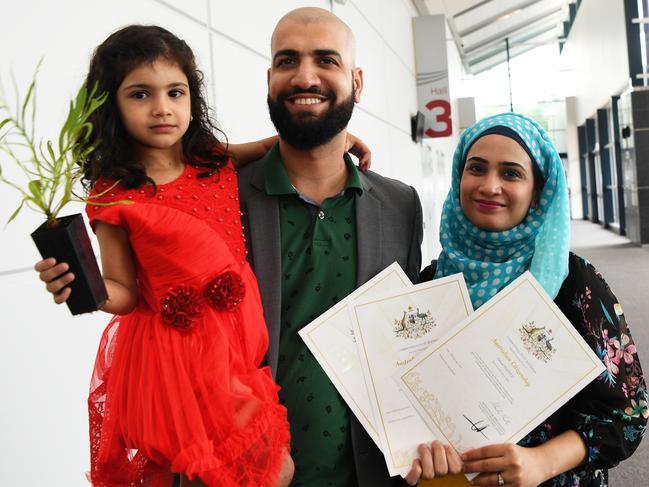 New Australian citizens Fatimah Fahad, Fahad Hafeez and Anum Fahad at the City of Darwin citizenship ceremony. Picture: Katrina Bridgeford