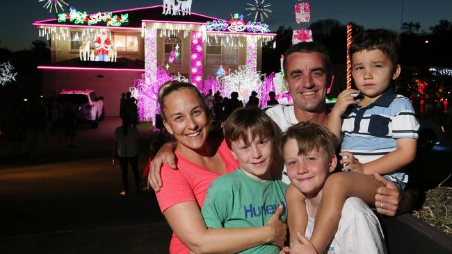 52 Forest Oak Drive, Upper Coomera is this year’s winning house. Pictured are the family behind the amazing display: Kellie and Matt Moore, with their children Ollie Moore 3, and twins Harry Daley and Sam Daley, 9. Picture Glenn Hampson