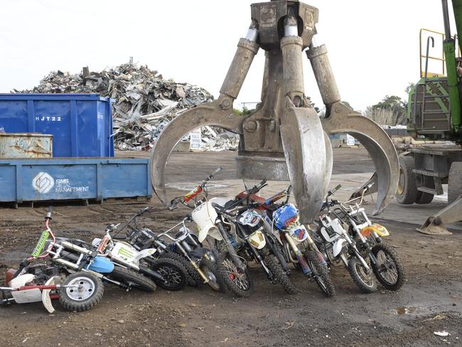 The bikes are lined up then crushed by a magnetic grab. Picture: Lawrence Pinder