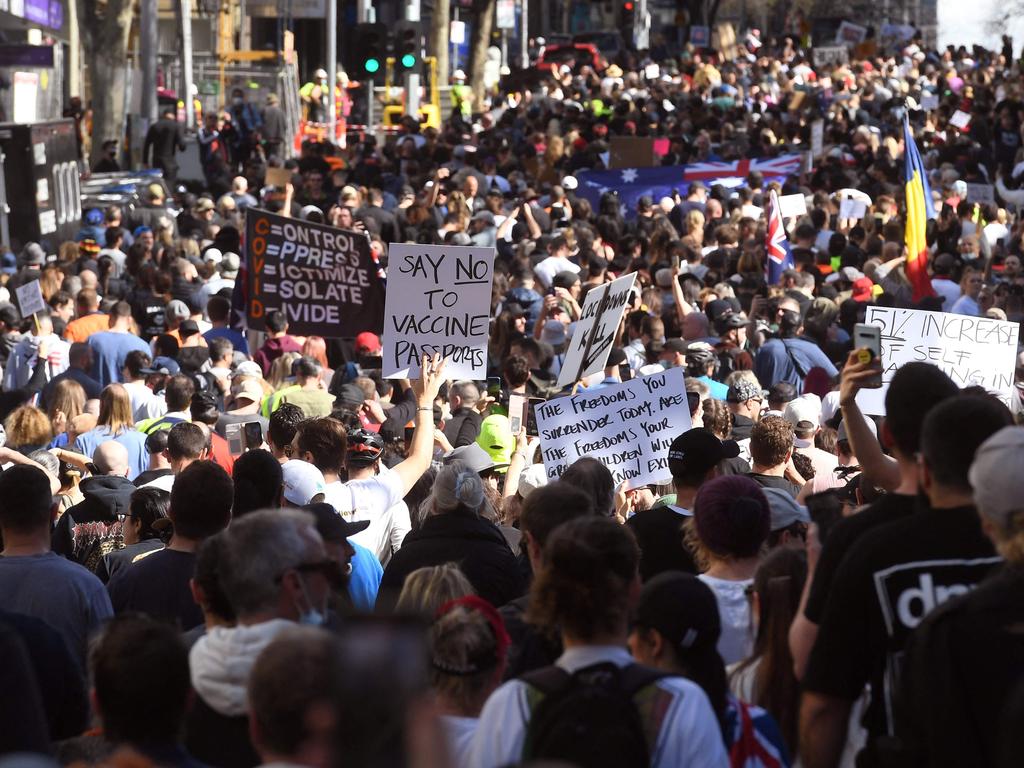 Protesters march through the streets during an anti-lockdown rally in Melbourne on Saturday.