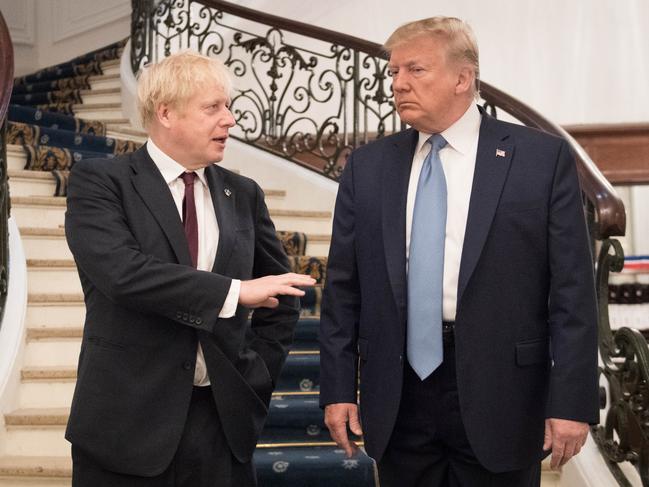 US President Donald Trump and Britain's Prime Minister Boris Johnson arrive for a bilateral meeting during the G7 summit in Biarritz, France. Picture: Getty Images