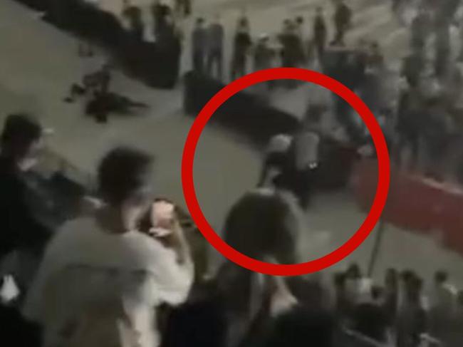 The footage shows the guard appearing to fly-kick the fan before he falls to the ground. Picture: Supplied