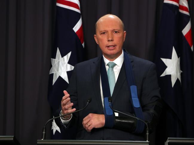 Home Affairs Minister Peter Dutton  holding a press conference at Parliament House in Canberra.