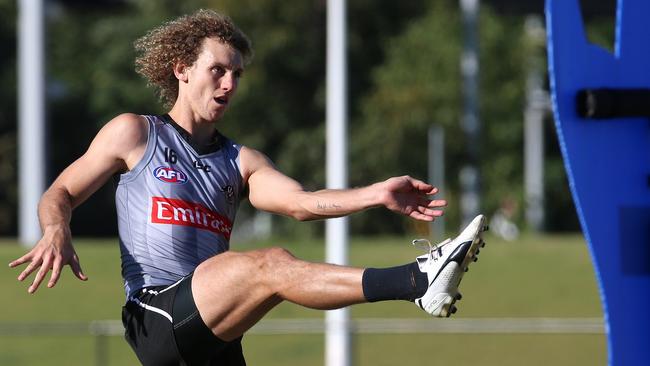 Chris Mayne practises his goalkicking at a Collingwood training session. Picture: Hamish Blair