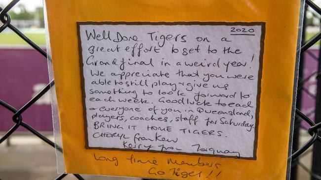 One fan left a note on a locked Gate 1 congratulating the team. Picture: Jason Edwards