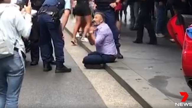 Pictured speaking to police shortly after the crash. Picture: 7 News