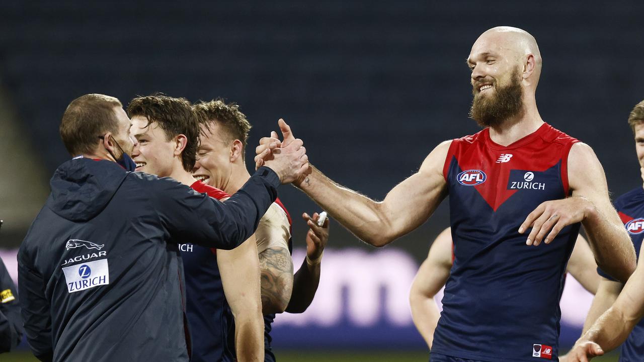 Demons head coach Simon Goodwin shakes hands with Max Gawn after his goal after the siren gave Melbourne over Geelong.