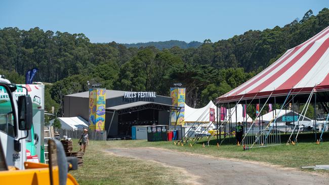 Trucks prepare to cart away the main stage’s music equipment. Picture: Jason Edwards