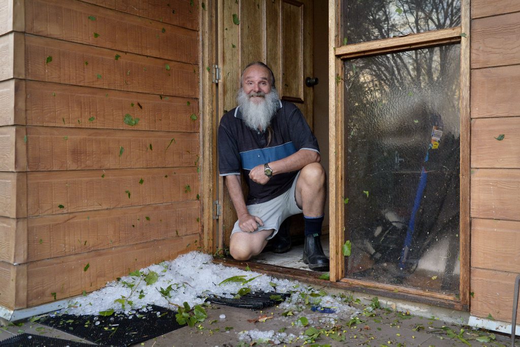 Fernvale resident Phill Anderson with some of the hail still at his house an hour after the storm. Photo Inga Williams / The Queensland Times. Picture: Inga Williams