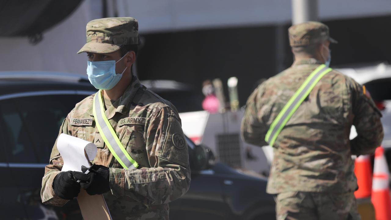 Members of the National Guard communicate with individuals at a newly opened coronavirus testing site in Brooklyn on April 11, 2020 in the Brooklyn borough of New York City. Picture: Spencer Platt/Getty Images/AFP.