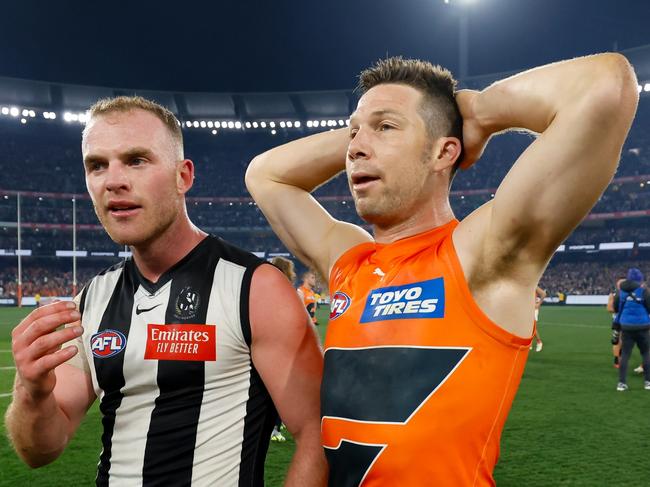 MELBOURNE, AUSTRALIA - SEPTEMBER 22: Tom Mitchell of the Magpies is seen with Toby Greene of the Giants during the 2023 AFL First Preliminary Final match between the Collingwood Magpies and the GWS GIANTS at Melbourne Cricket Ground on September 22, 2023 in Melbourne, Australia. (Photo by Dylan Burns/AFL Photos via Getty Images)