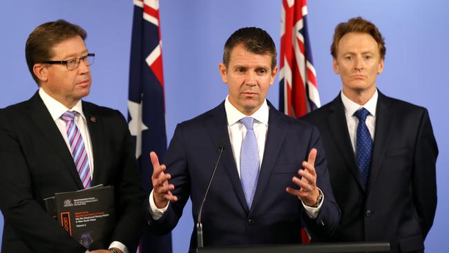 Premier Mike Baird announces the greyhound shut down, with Deputy Premier Tony Grant and RSPCA CEO Steve Coleman today. Picture: Stephen Cooper